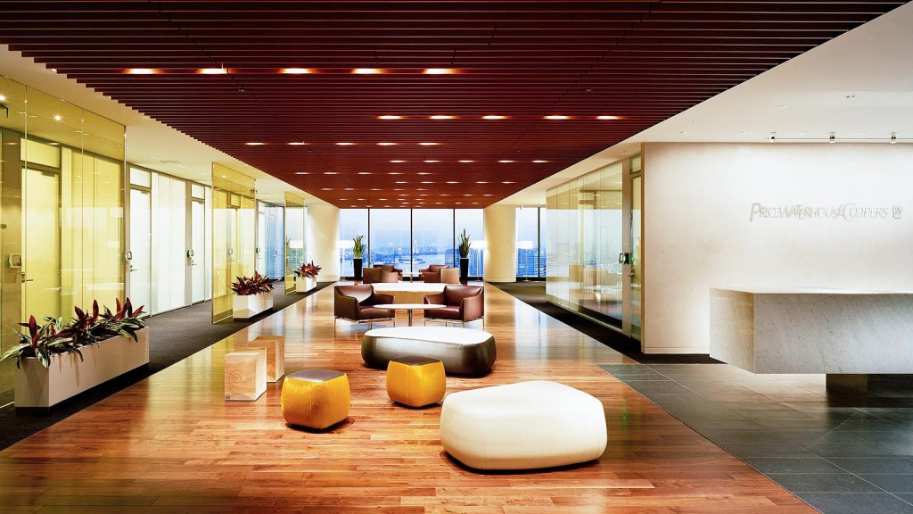 A large room with a large glass wall and a large white floor.