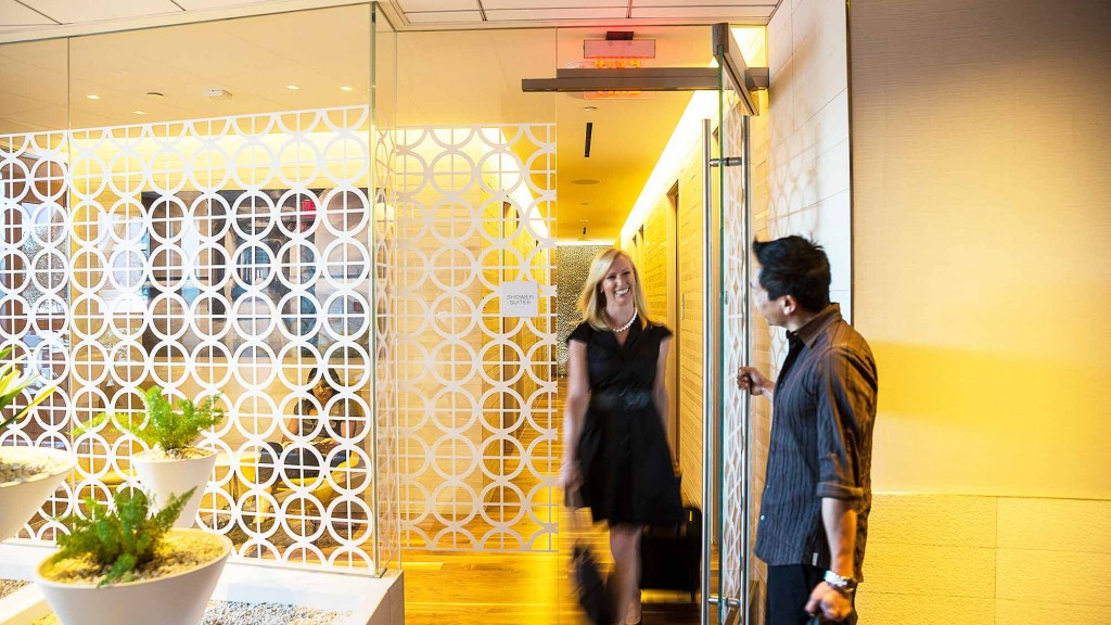 A man and woman walking through a building.