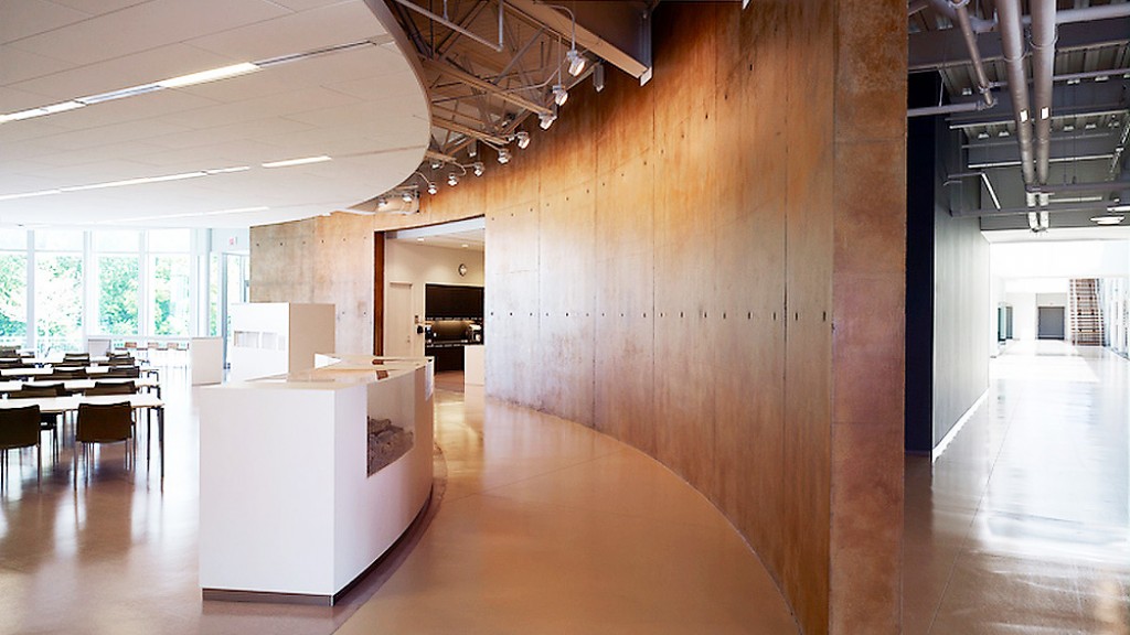 A large room with tables and chairs.