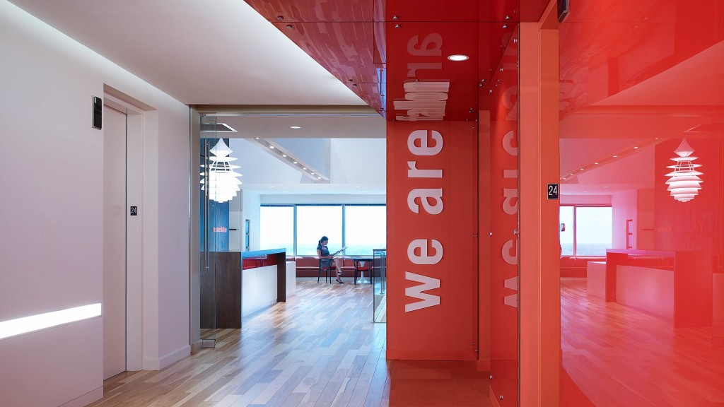 A hallway with a red wall.
