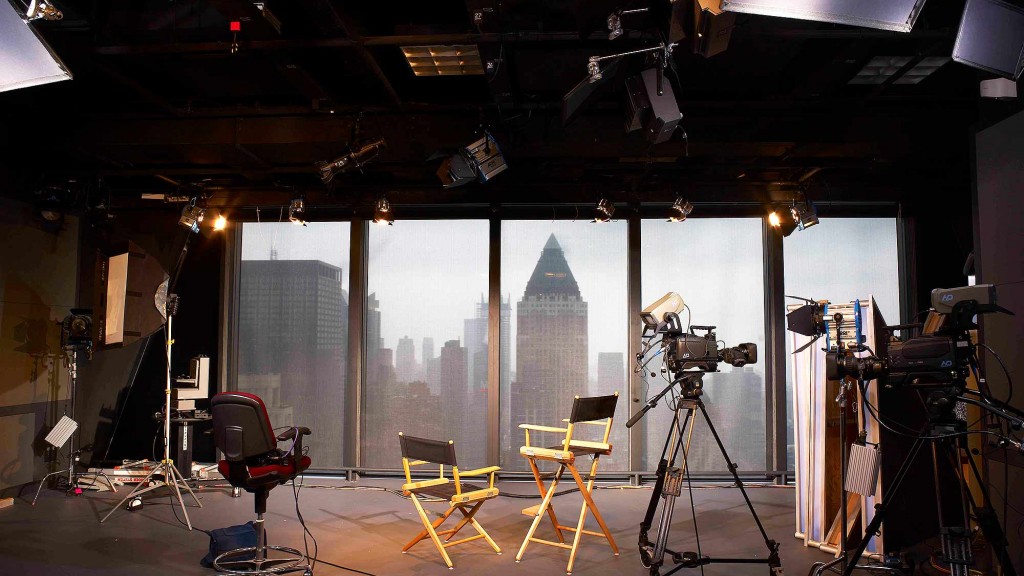 A room with a large window and chairs.