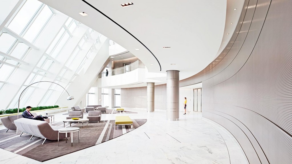 A person sitting in a lounge chair.