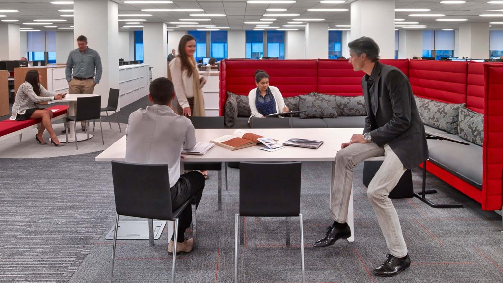 A group of people sitting around a table.