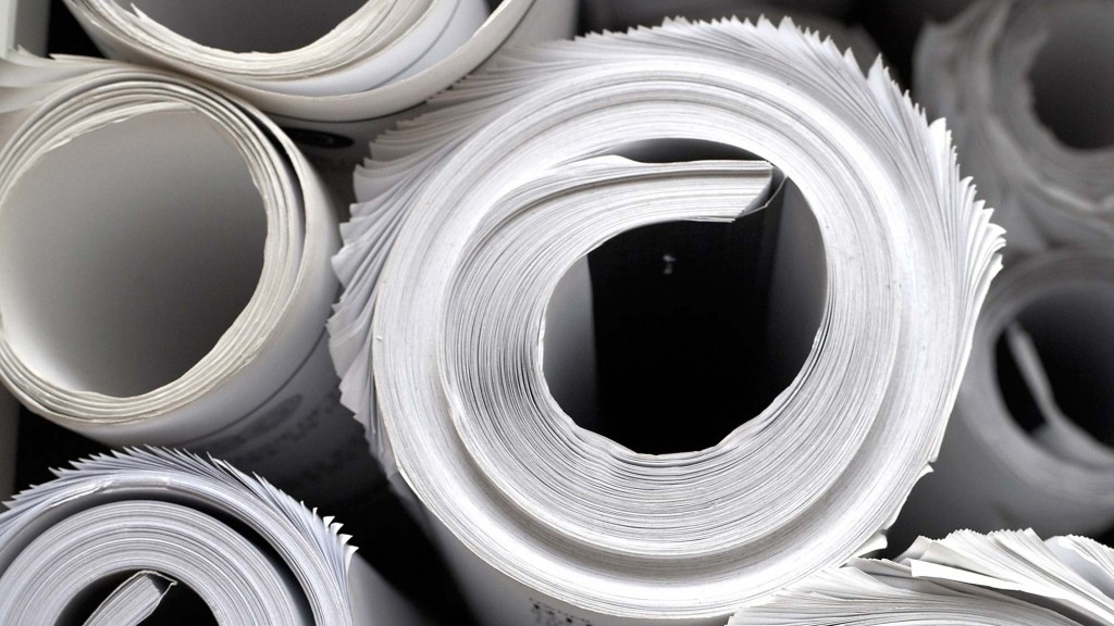 A close-up of several rolls of toilet paper.