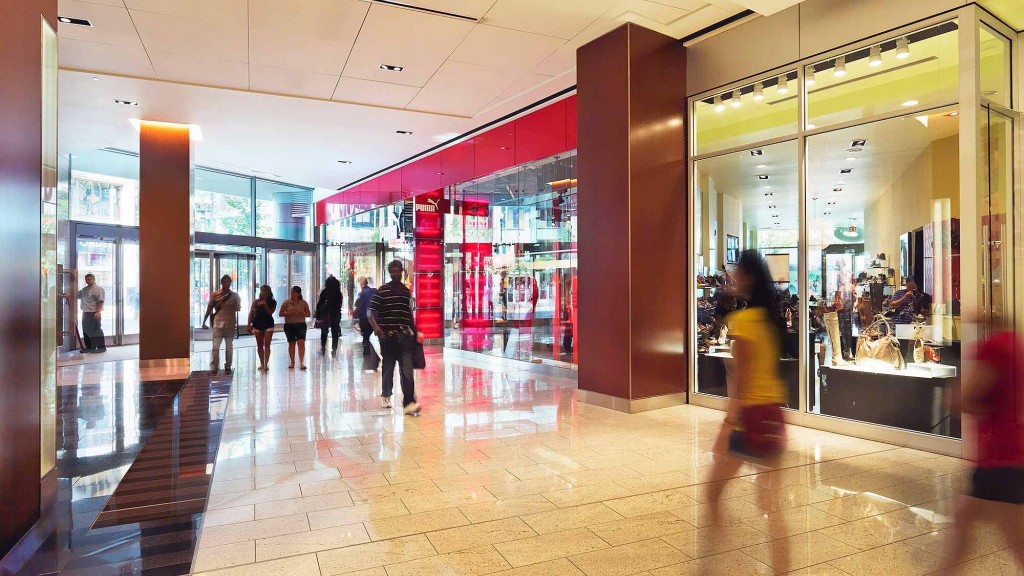 A group of people walking in a mall.