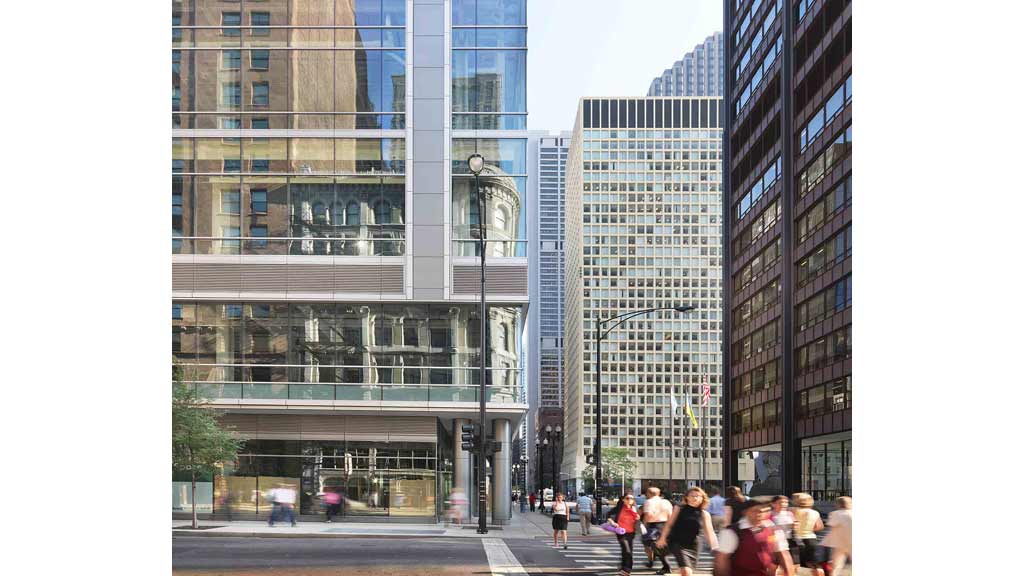 A group of people walking in a city.