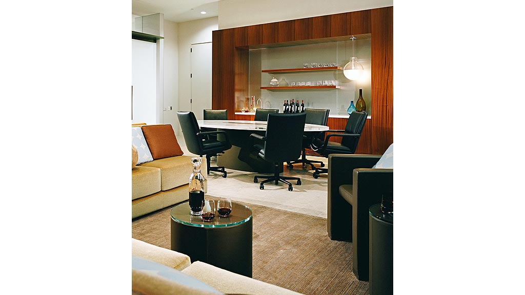 A room with a table and chairs.