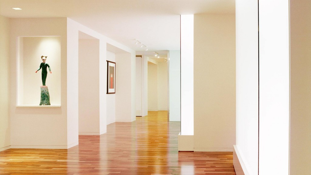 A hallway with white walls.