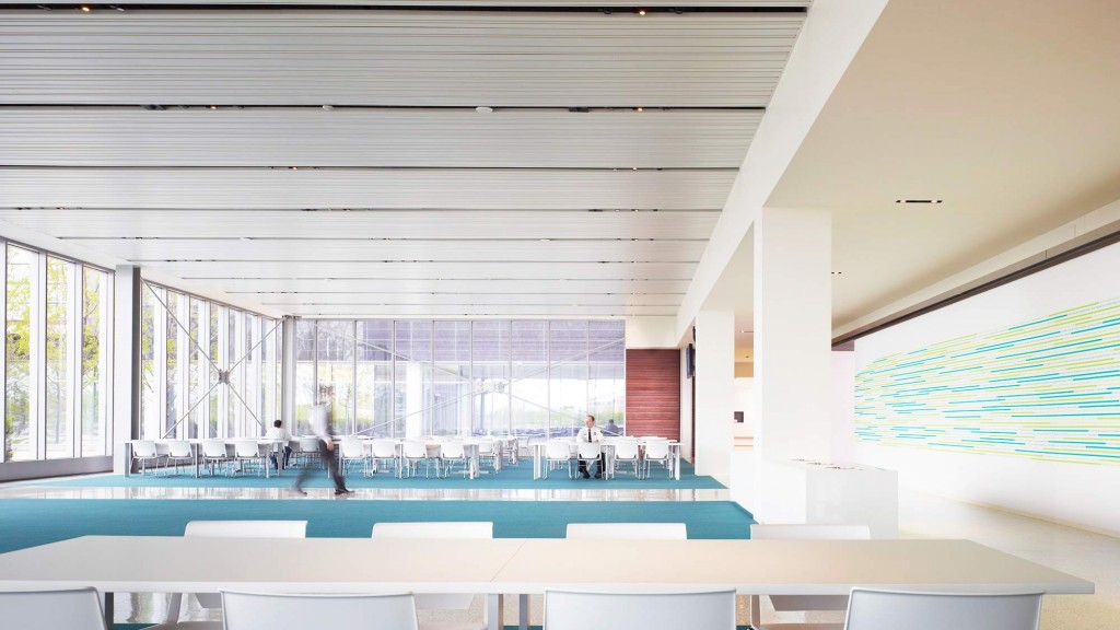 A swimming pool with chairs around it.