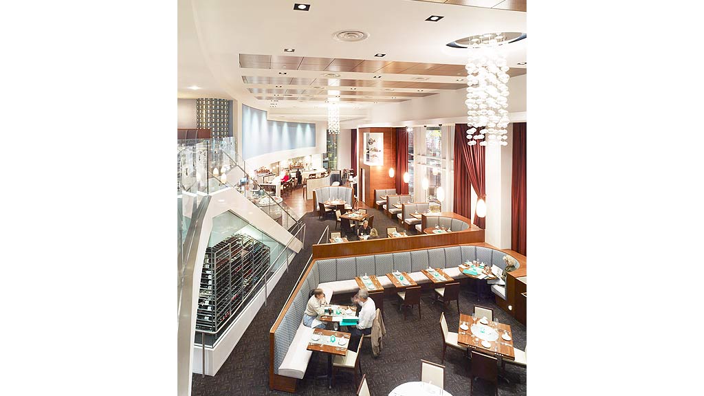 A large room with tables and chairs.