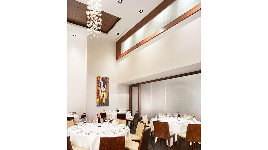 A room with tables and chairs.