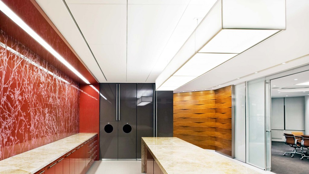 A room with a counter and a glass door.