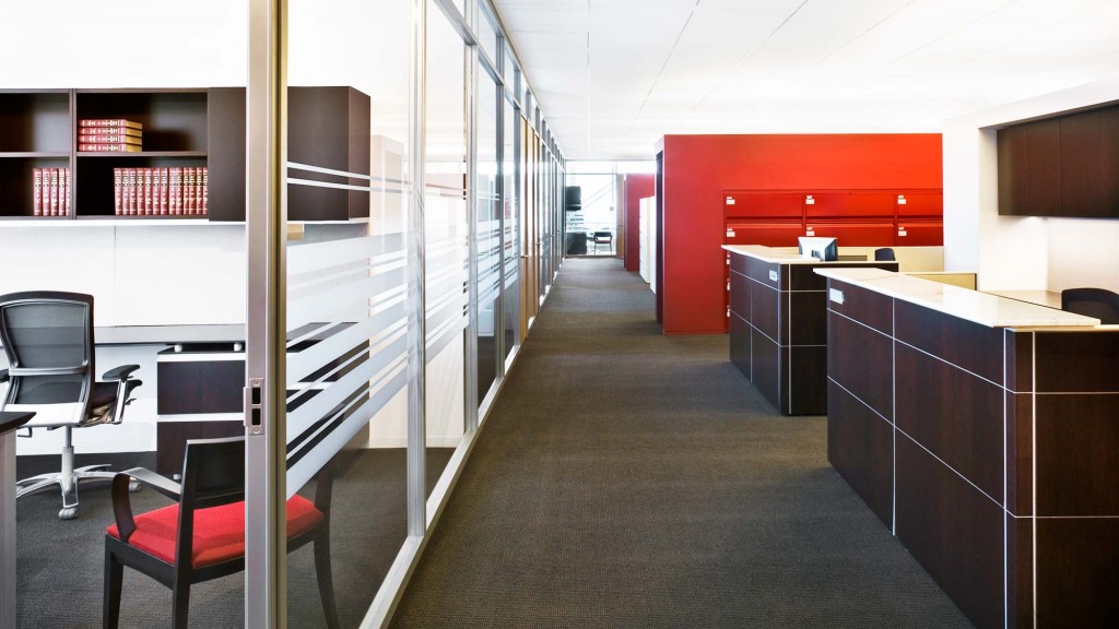 An office with a desk and chairs.