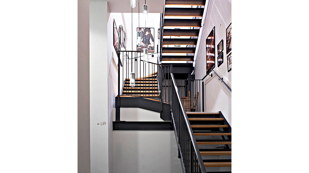 A staircase with a railing.