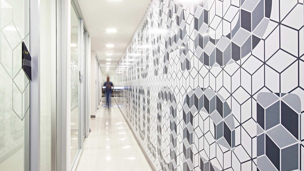 A person walking down a hallway.