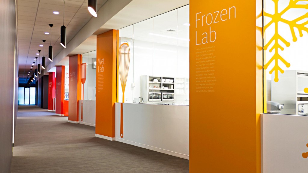 A hallway with red and white doors.