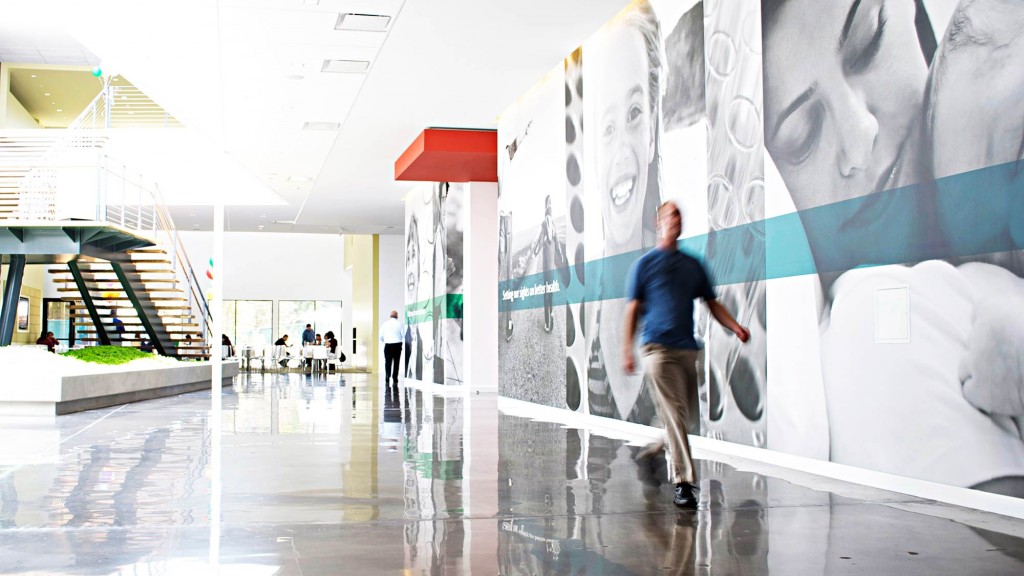 A man walking in a large room.