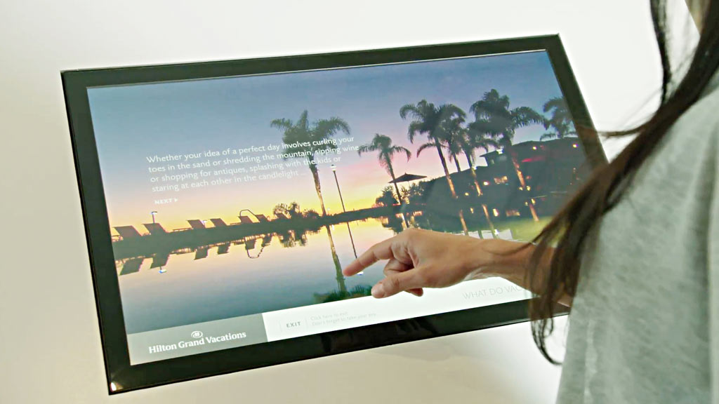 A person holding a tablet.
