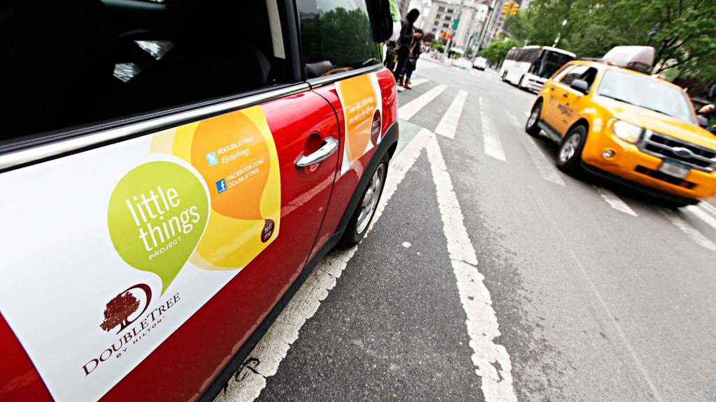 A yellow car on a road.