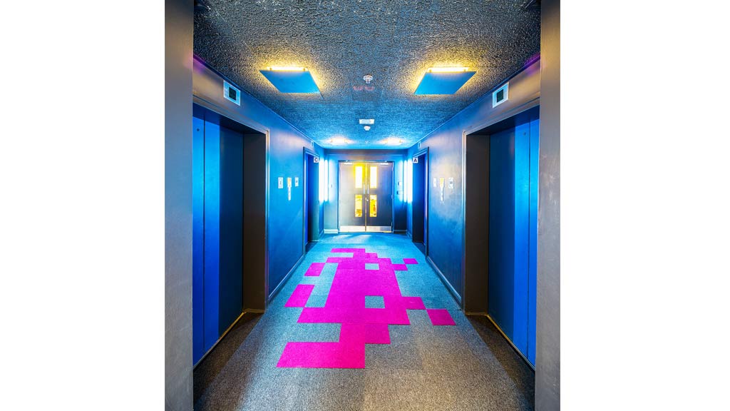 A hallway with blue doors.