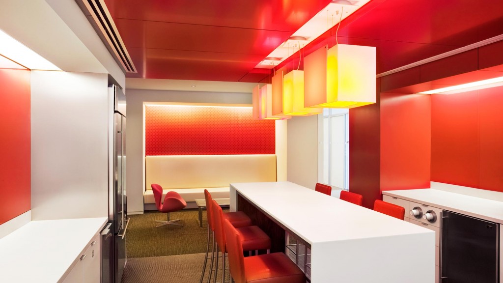 A room with a table and chairs.