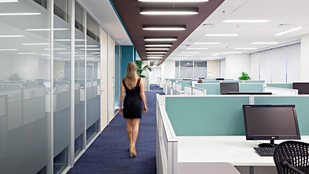A woman walking in an office.