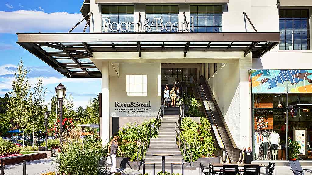 A building with stairs and plants.