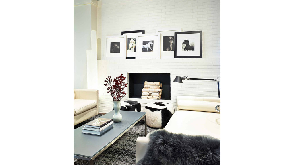 A living room with a fireplace.