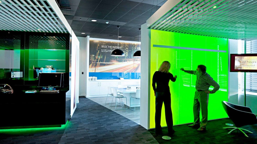 A couple of people looking at a screen.