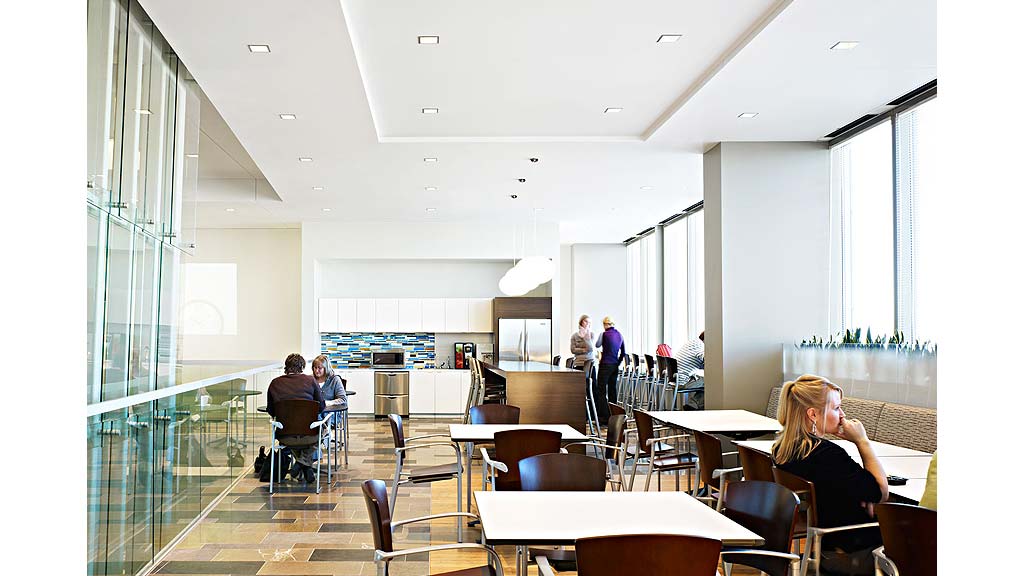 People sitting at tables in a room.