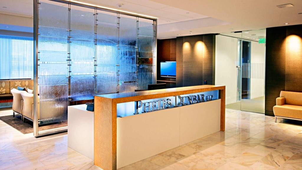 A room with a large glass wall and a pool table.