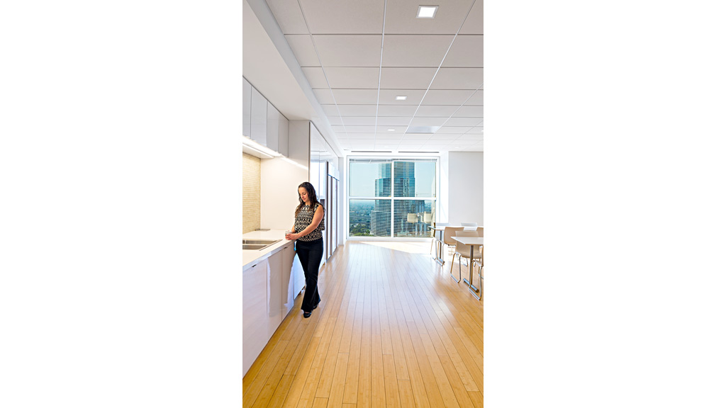 A person standing in a kitchen.