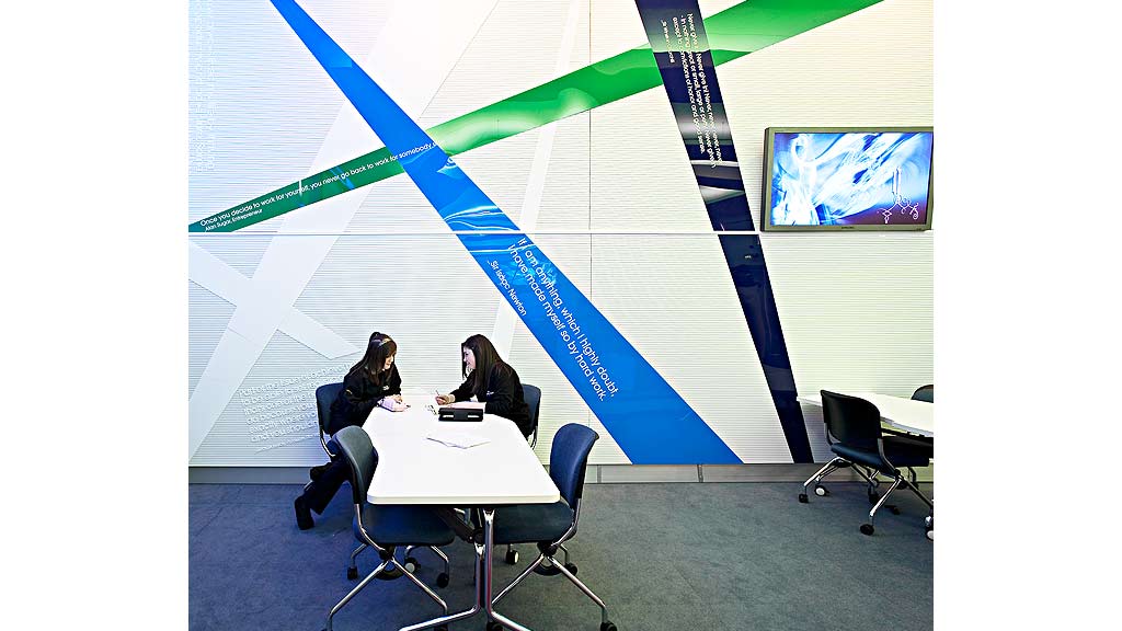 A few people sitting at a table.