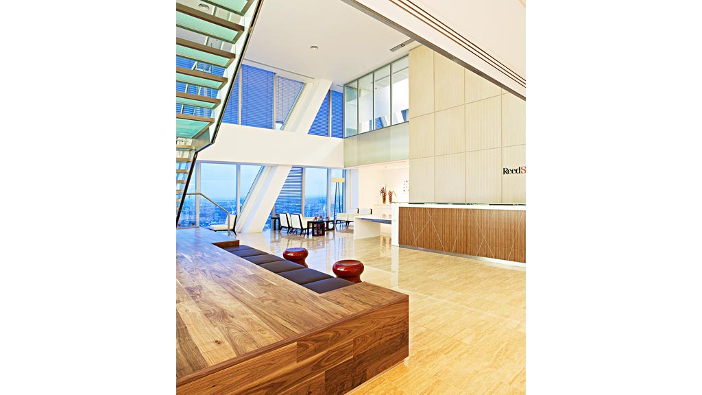 A room with a pool and a large glass ceiling.