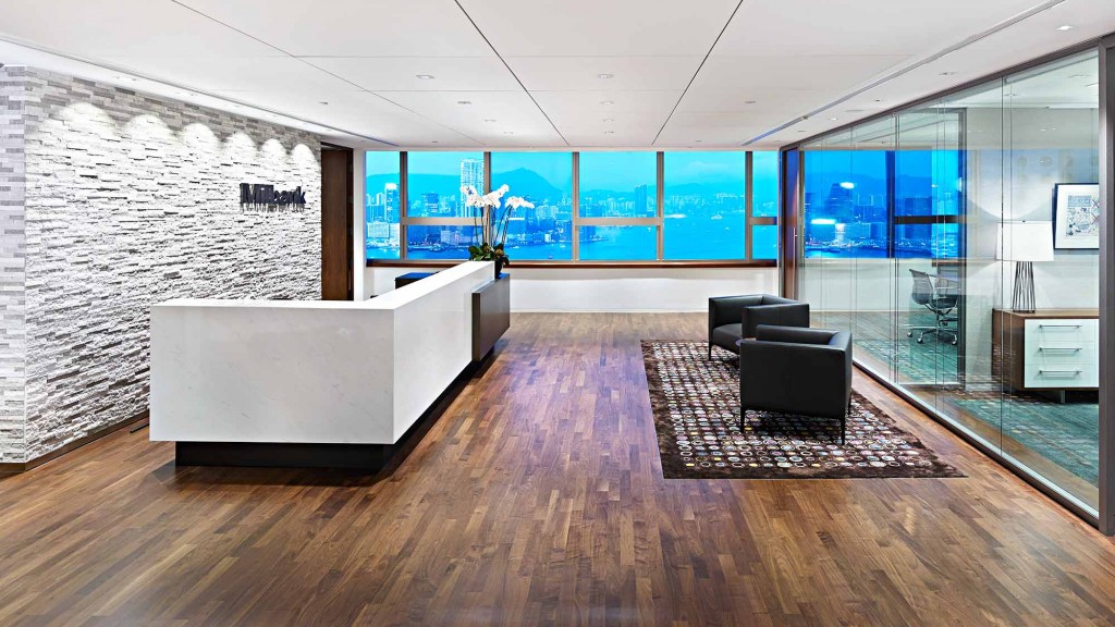 A room with a couch and a table.