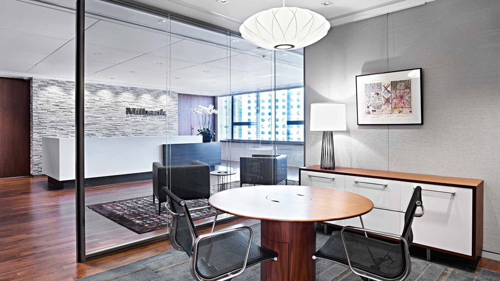 A room with a table and chairs.