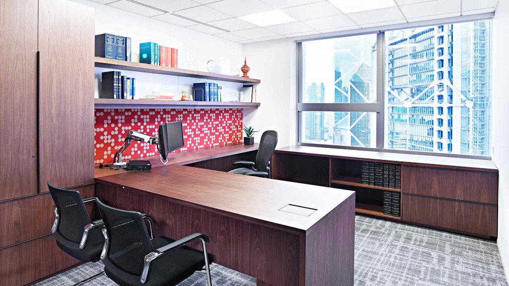 An office with a desk and chairs.