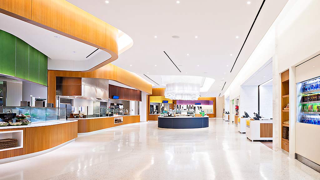 A large kitchen with a large white floor.