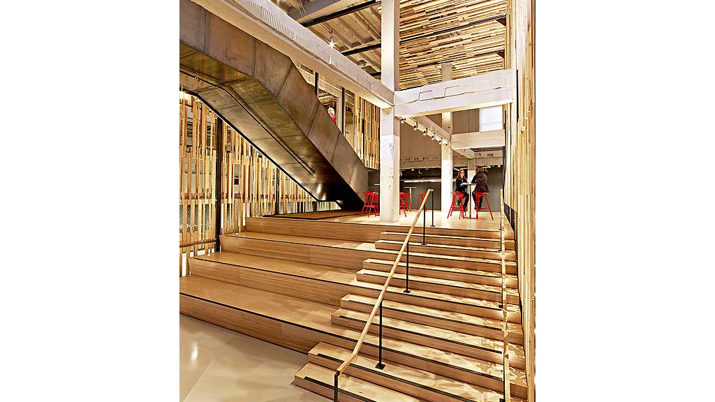 A group of people walking down a flight of stairs.