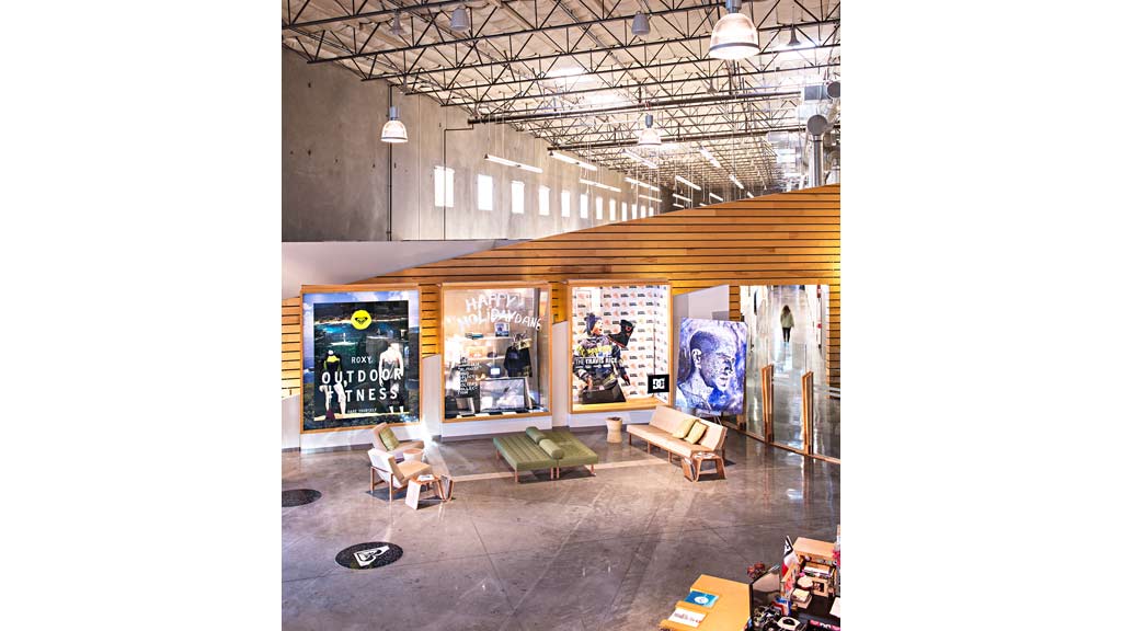 A room with benches and paintings.