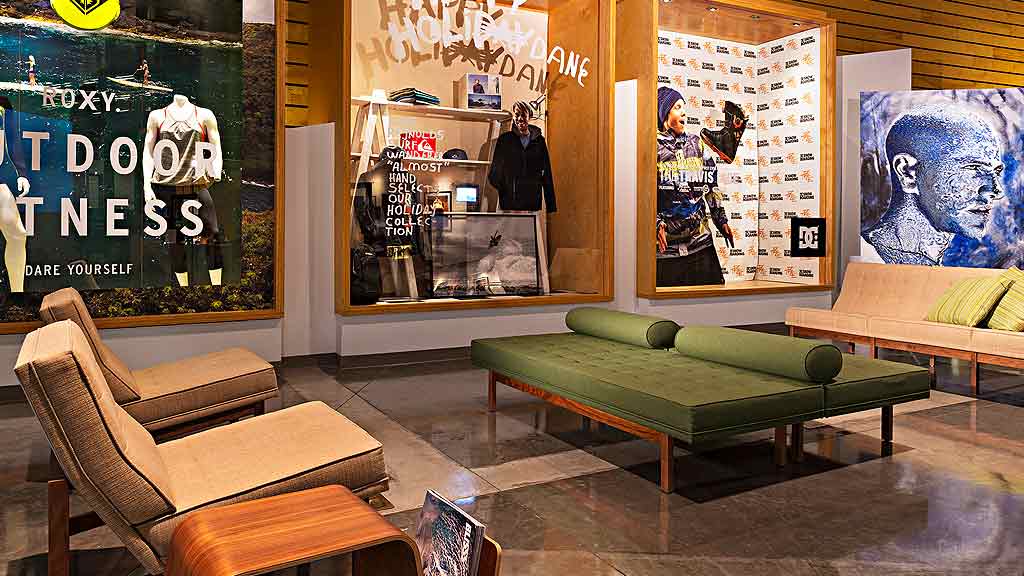 A room with a couch and a table.