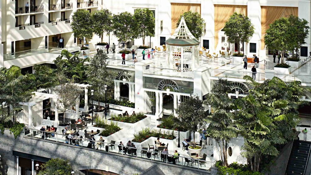 A courtyard with trees and buildings around it.