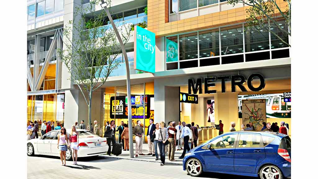 A group of people walking on the sidewalk next to a building.