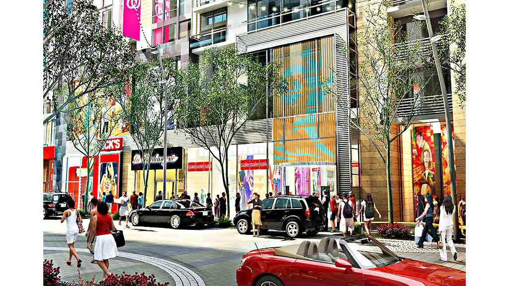 A busy street with cars and people.