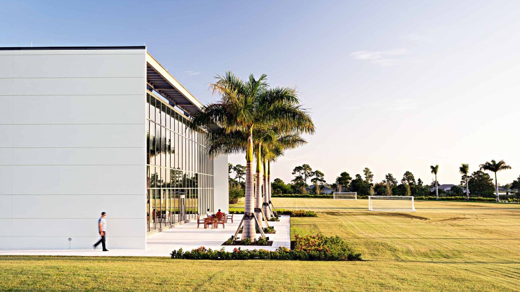 A person walking outside of a building.