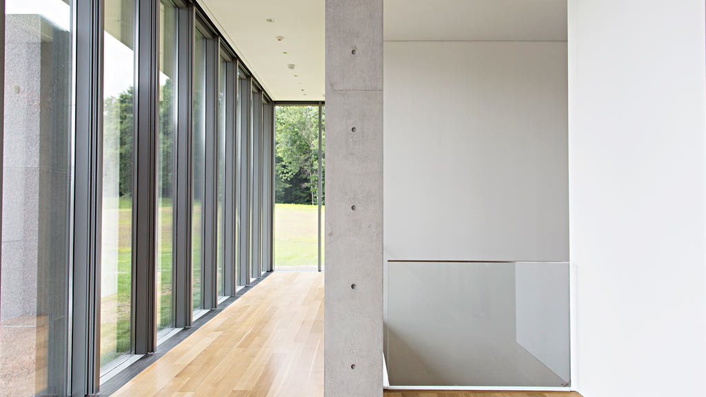 A hallway with glass doors.