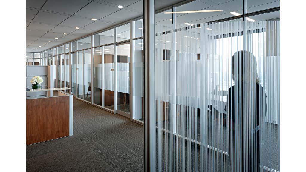 A long hallway with glass walls.
