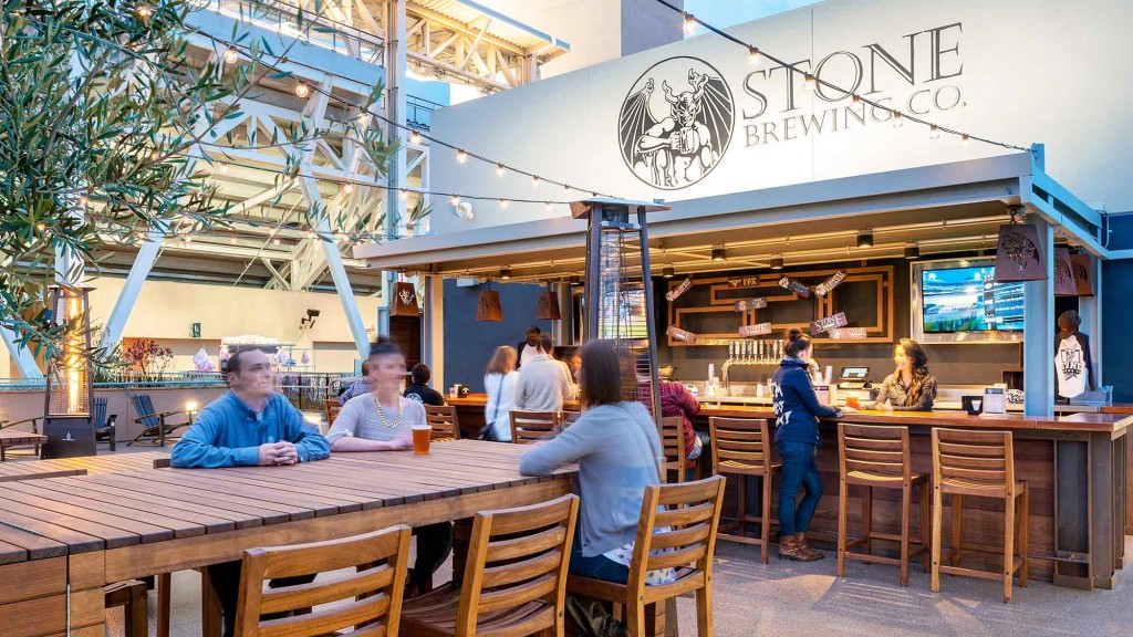 People sitting at tables outside a restaurant.
