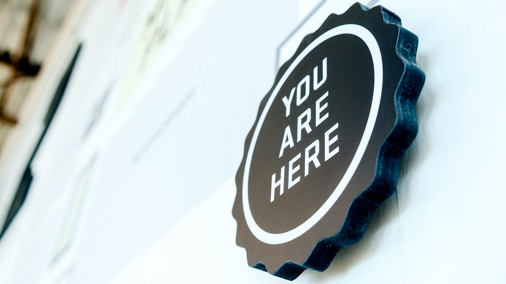 A black and white logo on a white surface.