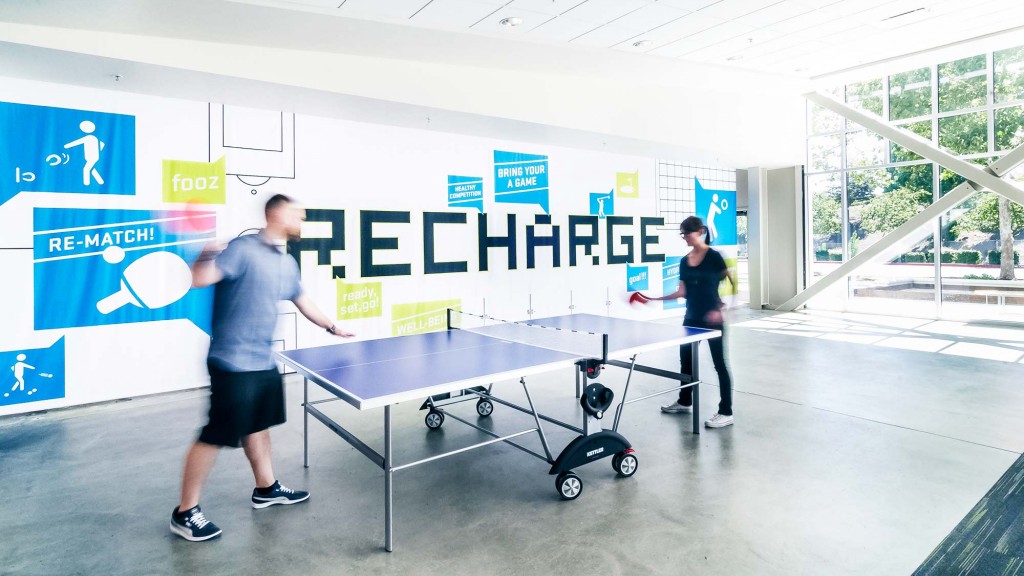 A few men pushing a cart.